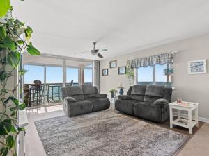 a living room with two couches and a view of the ocean at Crescent Beauty in Myrtle Beach