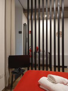 a bedroom with a bed and a black and white wall at Borgo Mantova in Potenza