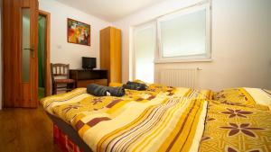 a bedroom with two beds and a window at Chata Motocentrum in Snina