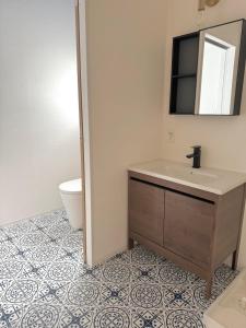 a bathroom with a sink and a toilet at Knot in Shodoshima