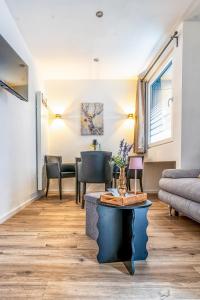 a living room with a couch and a table at Ferienwohnung 1 Gasthaus Bußmann Vreden in Vreden