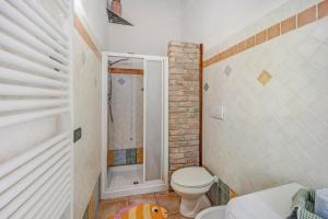 a bathroom with a toilet and a shower at Tutti Frutti in Pompeiana +17 photos