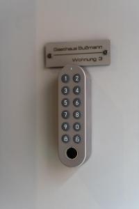 a remote control is attached to a wall at Ferienwohnung 3 Gasthaus Bußmann in Vreden