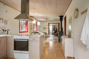 a kitchen with a stove top oven in a room at LF12118-Vinderup-Vigen-18 in Handbjerg +18 photos