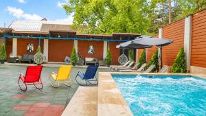 a group of chairs sitting next to a swimming pool at Hotel Sapphire Bakuriani in Bakuriani