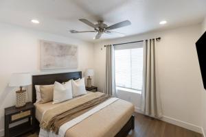 a bedroom with a bed and a ceiling fan at Heated Pool & Pickleball - Spacious & Immaculate Home in Washington +23 photos