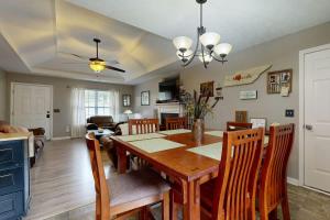 a dining room and living room with a table and chairs at Mount Juliet Charmer in Hunters Store +19 photos
