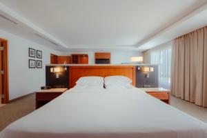 Ένα ή περισσότερα κρεβάτια σε δωμάτιο στο Sheraton Leon