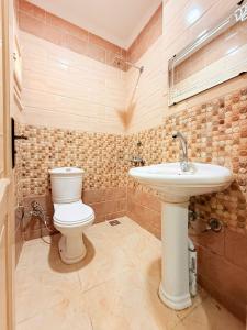 a bathroom with a toilet and a sink at Halla season matrouh in Marsa Matruh +31 photos