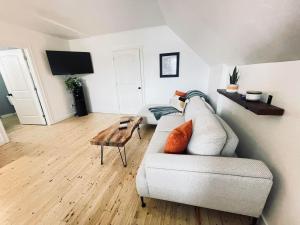 a living room with a couch and a table at Fin's Studio, Fundy Park in Alma