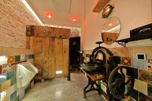 a bathroom with a urinal and a sink at Tiny Boat Berta in Ottenbüttel