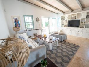 a living room with a couch and a table at Rose Pearl in Paternoster