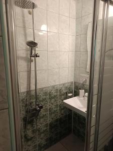 a bathroom with a shower and a sink at VIP in Ahtopol +67 photos