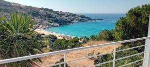 a view of a beach from a balcony at Mesakti in Armenistis