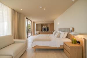 a bedroom with a large bed and a couch at Asfiya Sea View Hotel in Kalkan +96 photos