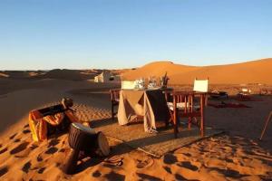 a table in the middle of the desert at Sahara Starlight camp in Merzouga