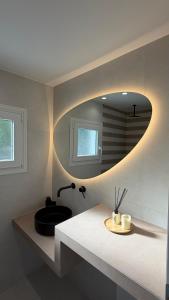a bathroom with a sink and a mirror at Naxian Roots in Galini