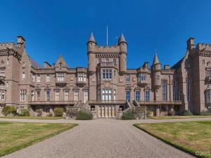 a large brick building with a pathway in front of it at Apartment Macduff Tower by Interhome in Angus