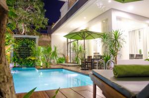 a swimming pool in the middle of a house at Hotel Five.S in Kampot