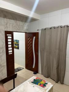 a bathroom with a shower and a shower curtain at Villa do mar Praia de Iracema in Fortaleza