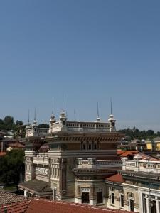 a large building in a city with roofs at Rooms Vincanto in Salsomaggiore Terme +5 photos