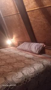 a bedroom with a bed in a attic at La Agraria in Junín