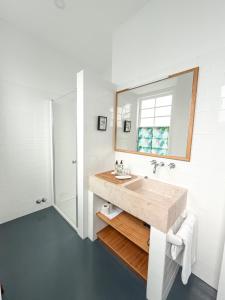 a bathroom with a sink and a mirror at Quinta das Buganvílias in Castelo Branco +54 photos