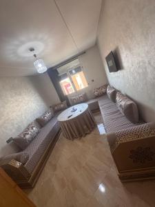 an overhead view of a living room with a couch and a table at Apartment Selouane in Selouane