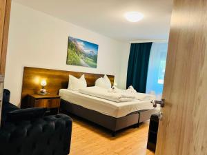 a bedroom with a bed and a couch at Haus Wandertal in Zella-Mehlis
