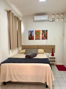 a bedroom with a large bed in a room at Recanto da Caatinga in Piranhas