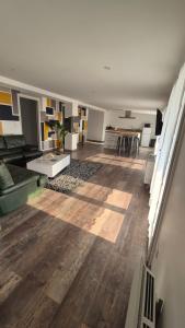 a living room with a couch and a table at ALBI Logement spacieux in Albi
