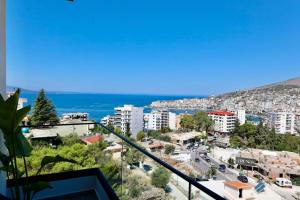 a view of a city from a balcony at Zeo Hotel Saranda in Sarandë