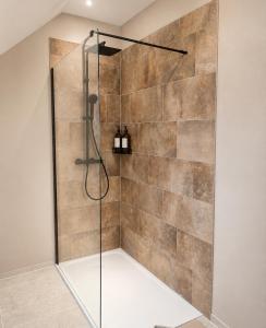 a shower with a glass door in a bathroom at Cap Ouest in Fécamp +44 photos