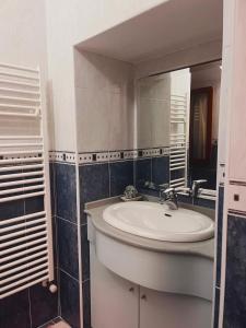 a bathroom with a sink and a mirror at B&B Rosy in Corato +29 photos