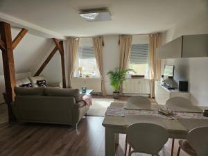 a living room with a couch and a table at Alte Schule Ragow in Ragow