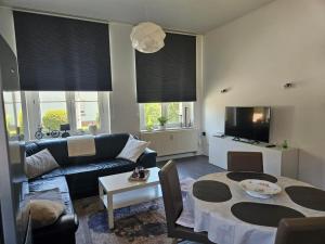a living room with a couch and a table at Alte Schule Ragow in Ragow