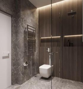 a bathroom with a toilet and a shower at The velvet pines in Mukteshwar