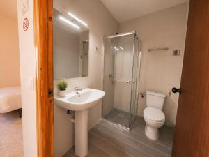 a bathroom with a sink and a toilet and a shower at Hostal la calma de Mascaraque in Mascaraque