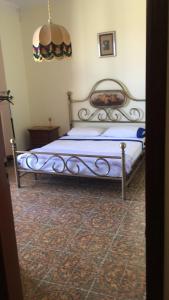 a bedroom with a bed in a room at Villa DonnAnna in Cariati