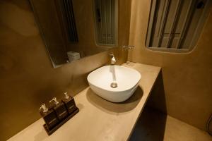 a white sink on a counter in a bathroom at Clove Bentota in Walagedera +120 photos