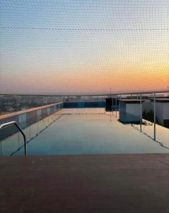 an empty swimming pool on top of a building at Casa Lucia in Pune