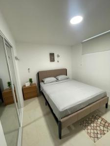 a bedroom with a bed in a room at Punta Centinela - Townhouse 200 in Punta Blanca