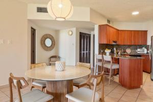 a kitchen and dining room with a table and chairs at Boho 2BR Retreat - Ocean View Terrace & Pool in Buena Vista