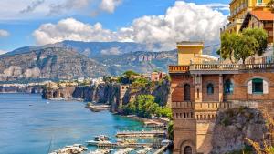 a view of the amalfi coast with boats in the water at Rooms Sorrento in Sorrento