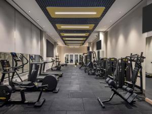 a gym with rows of treadmills and machines at Mercure Antalya Belek in Belek