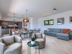a living room with two couches and a table at Villa Florinda by Interhome in Raša