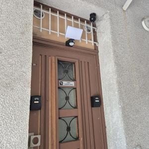 a wooden door with a sign on top of it at Appartement Jungle 4 places in Saint-Étienne