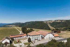 an aerial view of a village in the mountains at La Caquerelle in Col des Rangiers