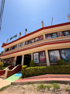 a building with posters on the side of it at Hotel Spa Chignahuapan Mágico in Chignahuapan