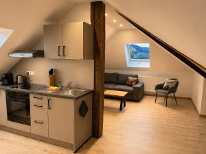 a kitchen and living room in a loft at Roserhof Gengenbach in Gengenbach